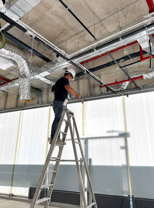 Workers carrying out ceiling services and reinstatement work